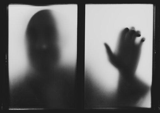 Shadow of a Man Behind the Window