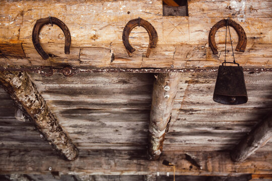 Old horseshoes and a cowbell on display at a blacksmith shop