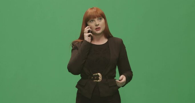 Studio, slow motion, green screen, an angry young woman on the phone, London, UK