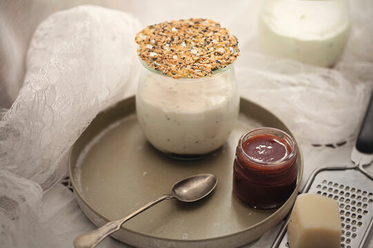 Marzipan-mascarpone mousse, spicy plum pulp, parmezan tuile in glass