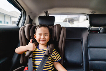 Back to School Concept.Happy Funny little asian boy raising hands thumb up and very excited and glad when he go back to school.Child from elementary school kindergarten.Safe trip safe drive.Traveller.