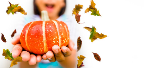 Happy kid girl in Autumn october month of Halloween and Jack o lantern with maple leaves fall on...