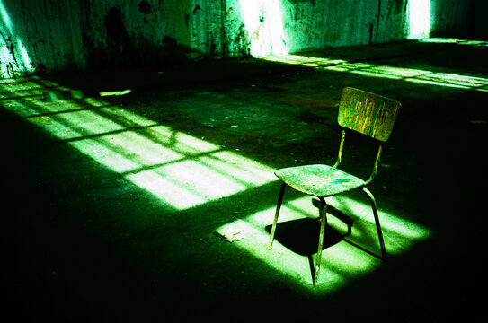Empty Old Chair in Abandoned Building