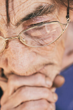 Eyes close up of old woman with glasses