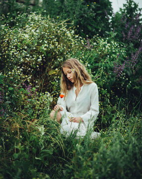 Portrait of a young woman in a field