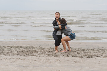 Teenage girl being lifted up by best friend