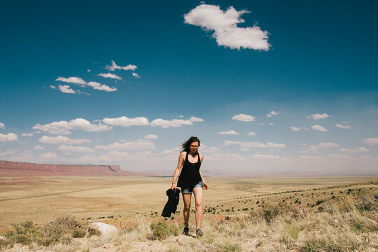 Girl Striding through the Desert