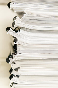 stack of white spiral-bound notebooks