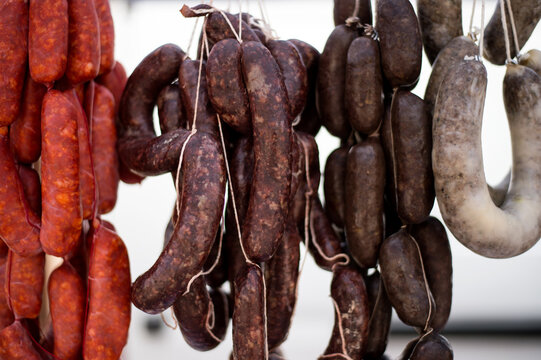 Raw sausages hanging