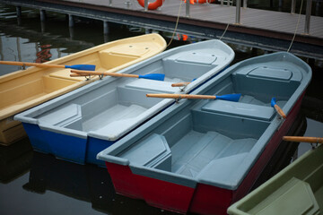 Boats on the water. Swimming aids. Water transport moored to the pier.