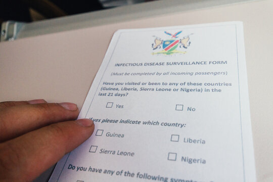 Infectious disease surveillance form on an airplane in Africa