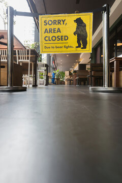 Sorry, area closed due to bear fights sign in front of a cafe