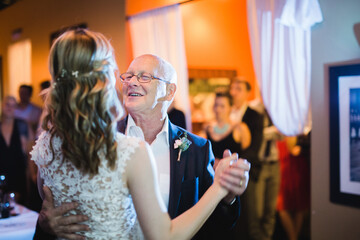Father dancing with his daughter at a wedding