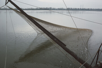 Extension arm with trawling net