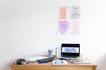 Calligraphy designer's messy working table