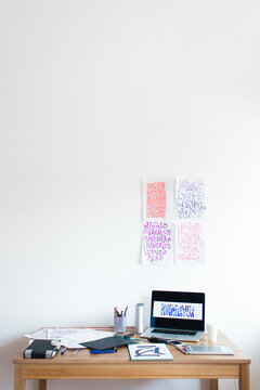 Calligraphy designer's messy working table