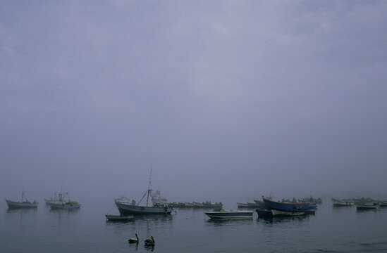 Old boat in a foggy sea