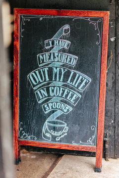 Chalkboard sign with coffee quote
