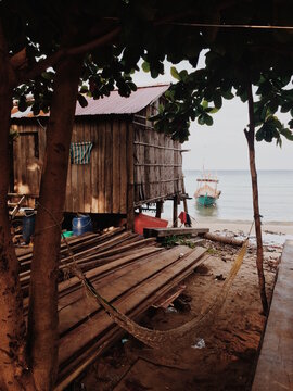 Small fishing boats in water on tropical island in Asia