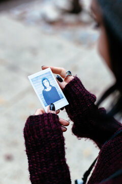 Woman holding a Polaroid