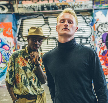 Graffiti portraits of two fashionable young men