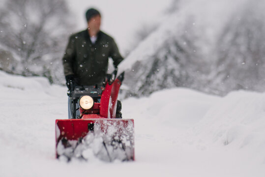Man using a snowblower