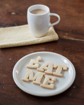 Shortbread Cookie Letters spelling out the words ""eat me"" during a tea break