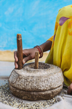 Women grinding at the mill,India