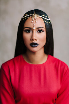 Glamour portrait of an African American woman with a pearl chain headpiece