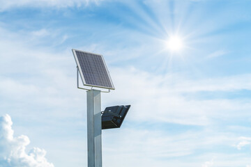 Obraz premium Small size solar plant, outdoor lighting pole with small solar panel power by themself is new technology and energy trend for public area in the city