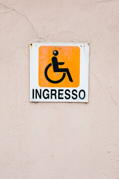 Entrance Wheelchair sign on the wall in Italian