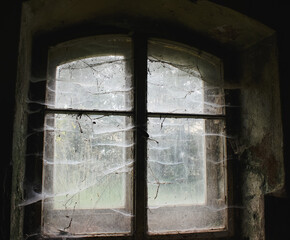 Spooky, cobweb covered window