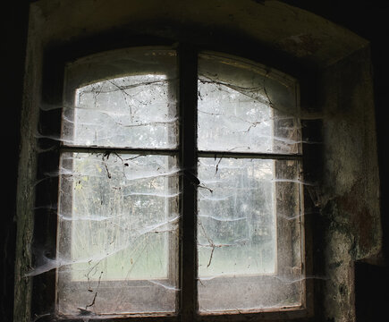 Spooky, cobweb covered window