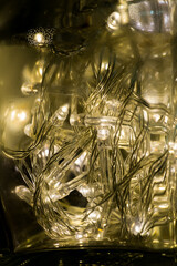 many LED bulb with electric wire in the clear glass bottle, power of light make water drop from moisture in the bottle