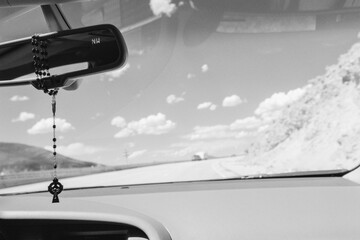 Cross hanging from the mirror