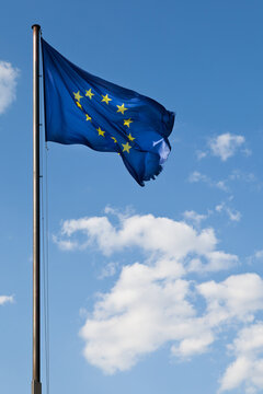 EEC Flag over a Blue Radiant Sky