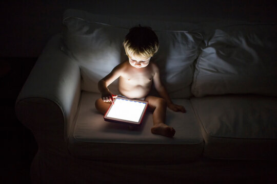 1 year old boy looking a digital tablet