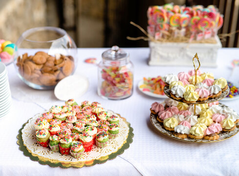 Wedding reception table full of colorful sweets