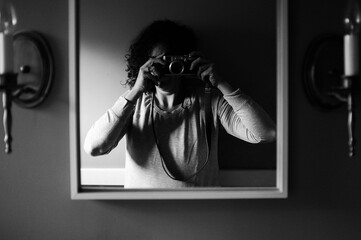 Self-portrait in mirror with camera