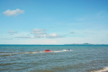 boat and jet ski popular activity on the beach in Thailand in the summer 