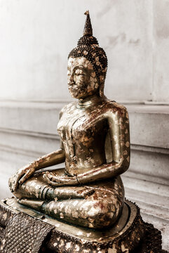 Buddhist statue covered with gold papers