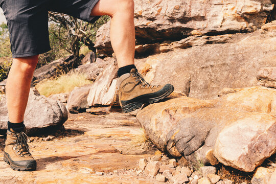 man hiking on rocky terrain