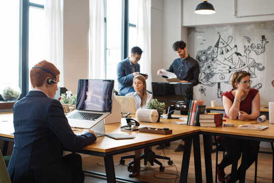 Young People Co-Working in Large Bright Office
