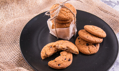 Shortbread cookies on a black plate,side view