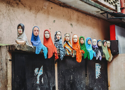 Mannequins on the streets of Kuala Lumpur, Malaysia wearing traditional Muslim clothing