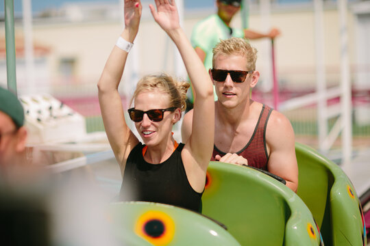 Young couple enjoys a roller coaster ride