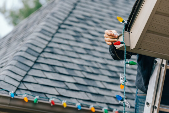 Man putting up the Christmas Lights