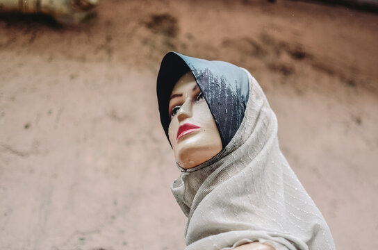 Mannequin on the streets of Kuala Lumpur, Malaysia wearing traditional Muslim clothing