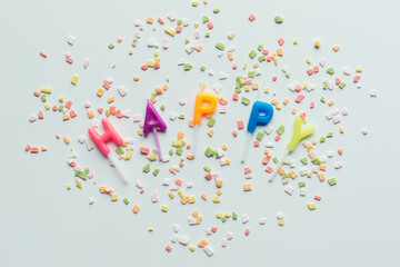 Word 'Happy' Written With Candle Letters