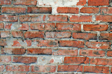 Weathered stained old brick wall background